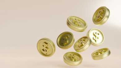 A bunch of gold buttons flying in the air