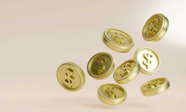 A bunch of gold buttons flying in the air