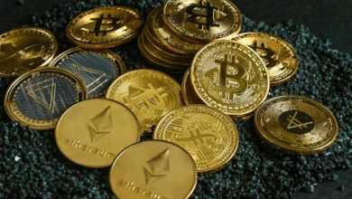 a pile of gold and silver bitcoins