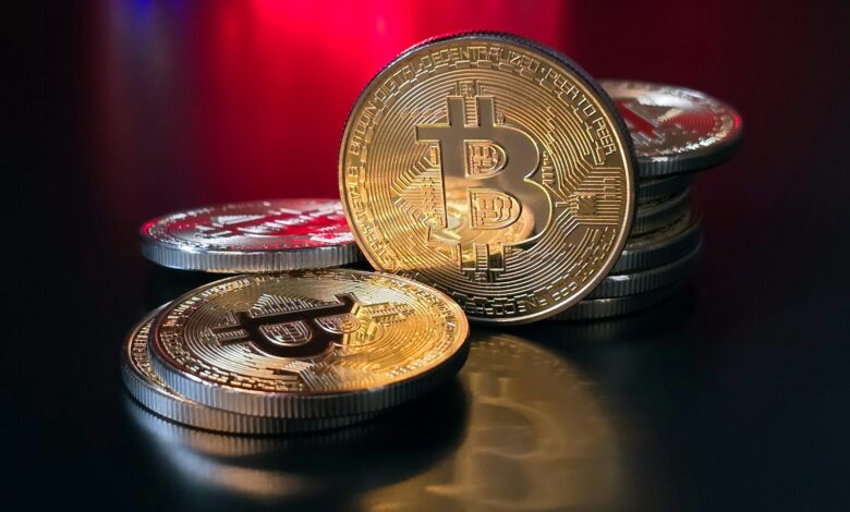 a pile of bitcoins sitting on top of a table